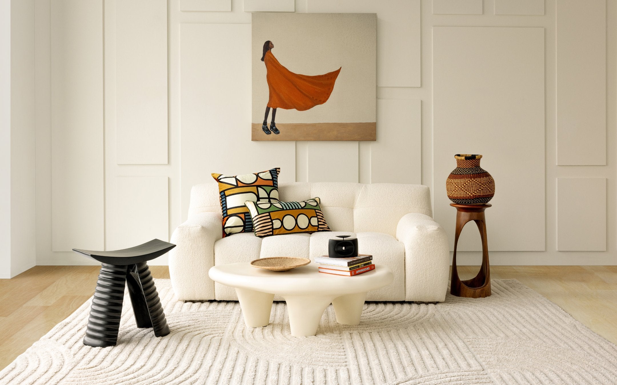 Styled living room with Tekura side tables, Rhen Ovations Art, Baba Tree Baskets and Lulasclan Pillows.