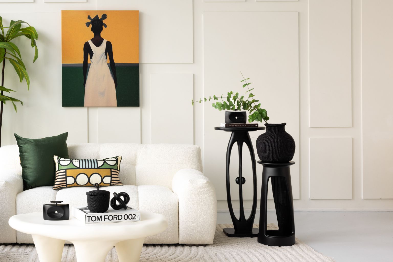 Styled living room with Tekura side tables, Rhen Ovations Art, Baba Tree Baskets and Lulasclan Pillows.