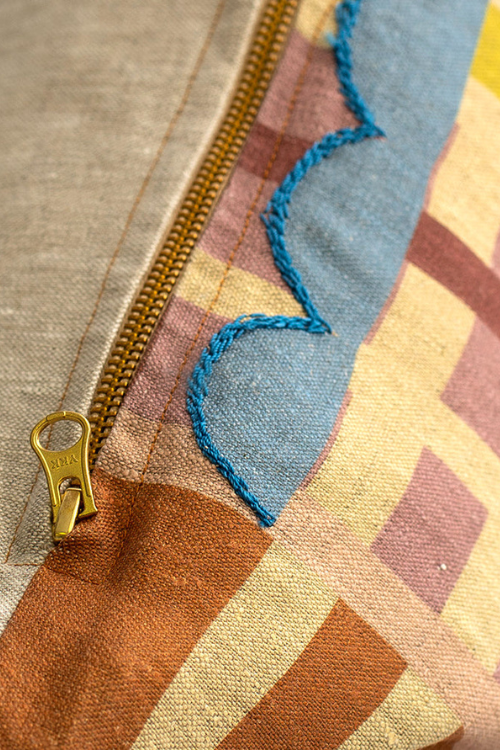 Embroidered linen pillar pillow by Lulasclan featuring intricate embroidery and a soft, textured fabric for decorative comfort.