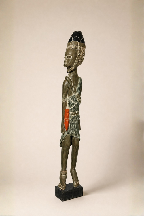 Tekura African male warrior sculpture featuring detailed traditional attire and fierce expression, showcasing craftsmanship and cultural art.