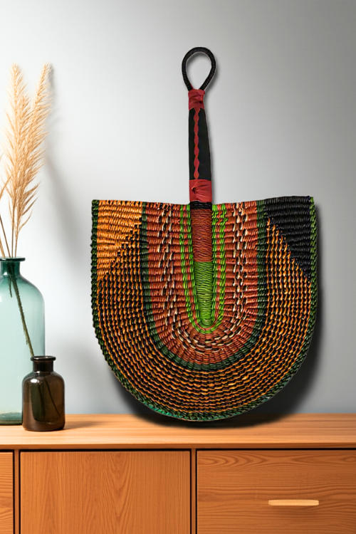 The Handcrafted Bolga Decorative Fan - Kente Geometric Design - Handwoven Elegance from Ghana is a cost-conscious way to bring authentic African craftsmanship into your home.