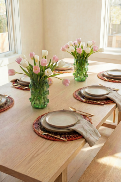 Baba Tree Earthy Blossom placemats set with pink, brown, and orange tones, styled on a natural-colored place setting.