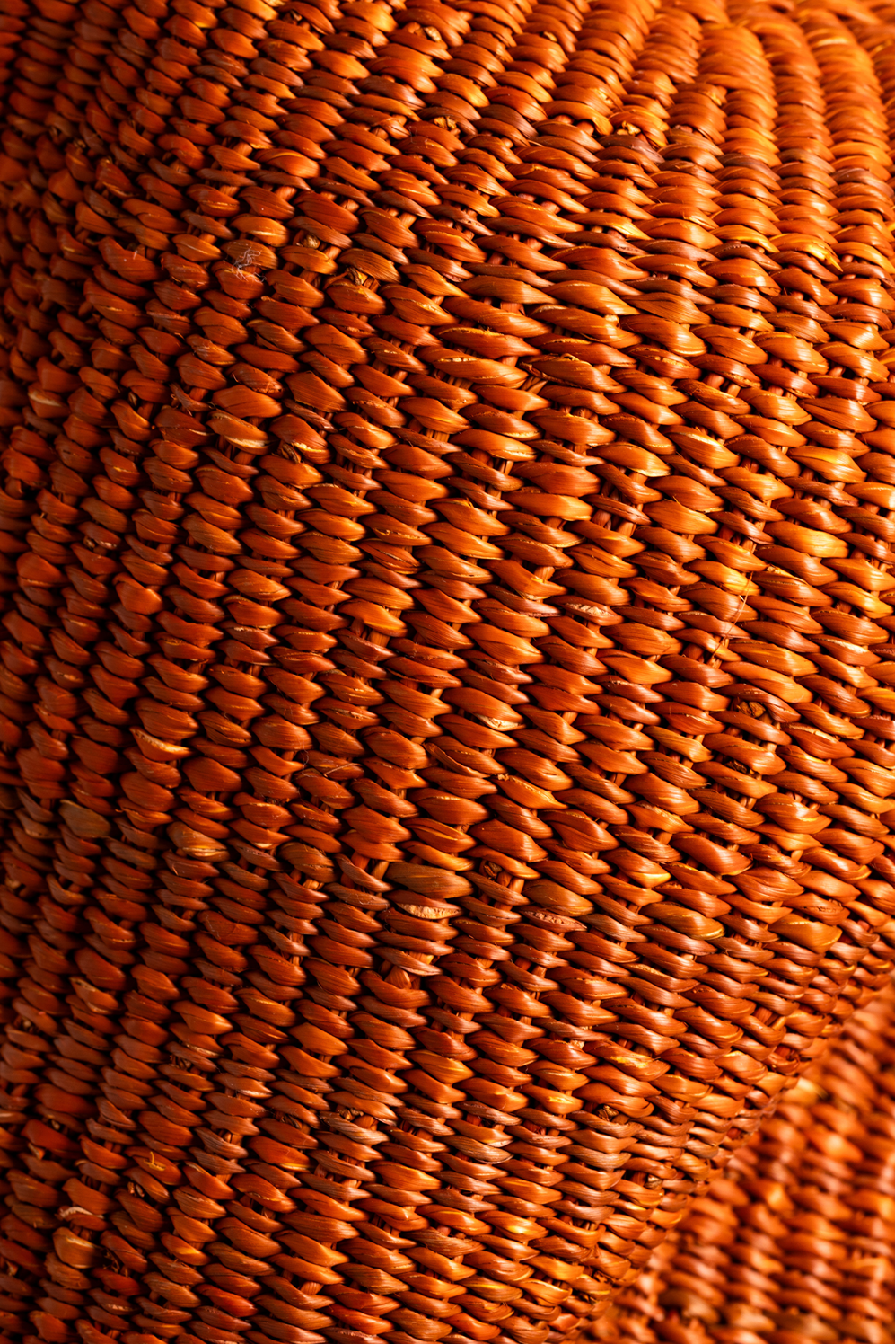 Close-up of Baba Tree Yoomelingah Yure artisan basket in Sienna, showcasing woven craftsmanship and natural earthy tones.