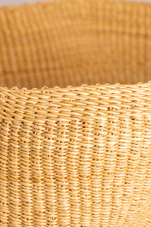 Close-up of Baba Tree Pakurigo Wave Basket in Natural Dune, a stylish woven storage basket with a wave pattern.