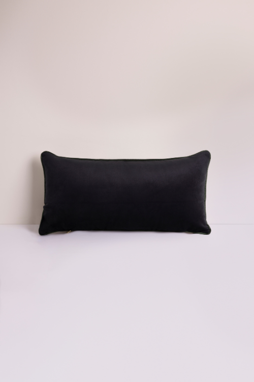 Black velvet lumbar pillow by Lulasclan with a sleek, plush surface, designed for comfortable support and stylish decor.