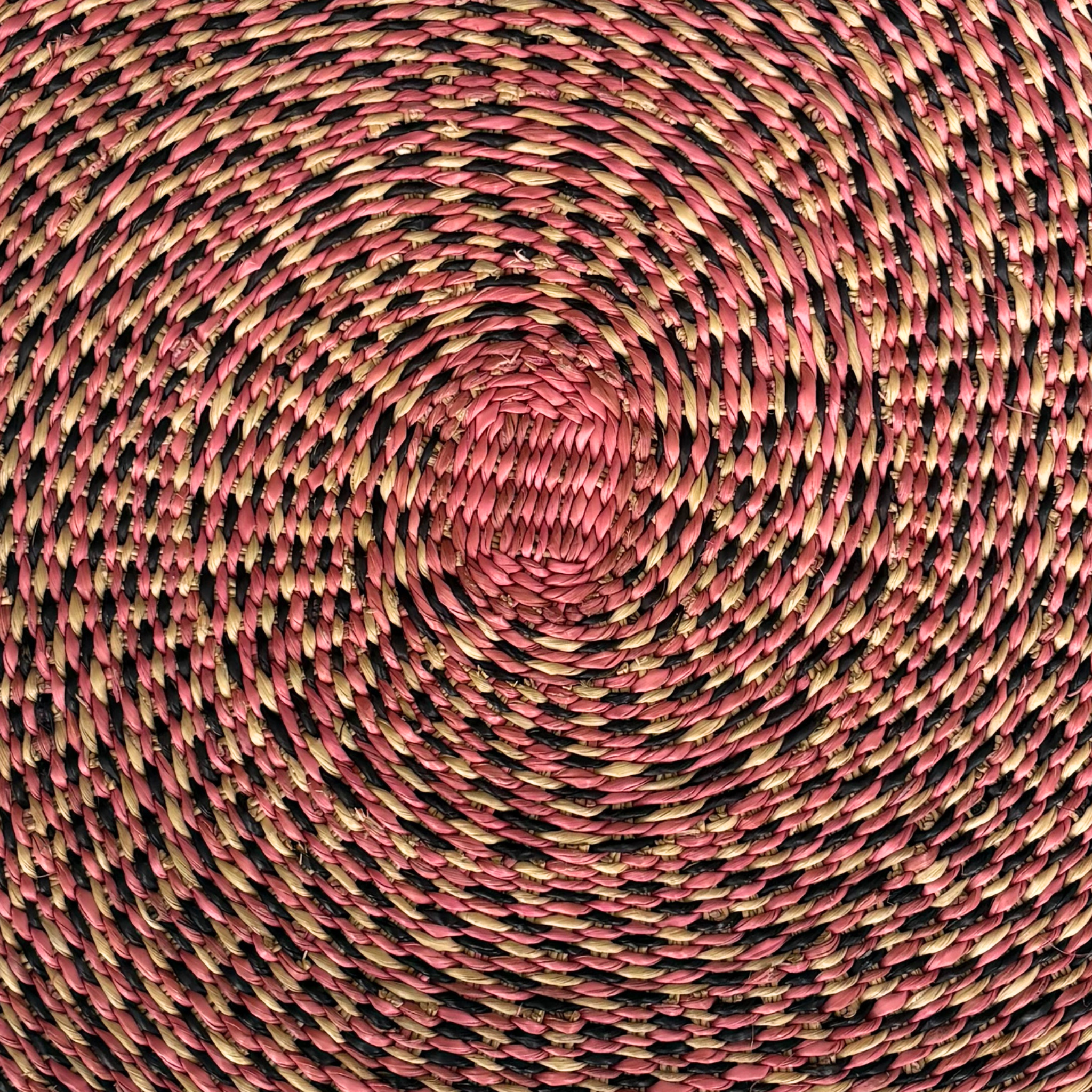 Baba Tree Placemats - Harmony. Close up of handwoven placemat in pink, green, brown.