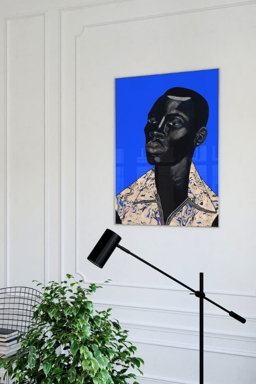 "Remy II" Fine Art Print features a Black man with intense, thoughtful eyes set against a vibrant sapphire Blue background. Remy's deep ebony skin is beautifully accentuated with subtle highlights, creating a sense of depth and dimension. His Blue geometric patterned collared shirt adds a soft contrast to the bold palette, embodying both strength and sensitivity.