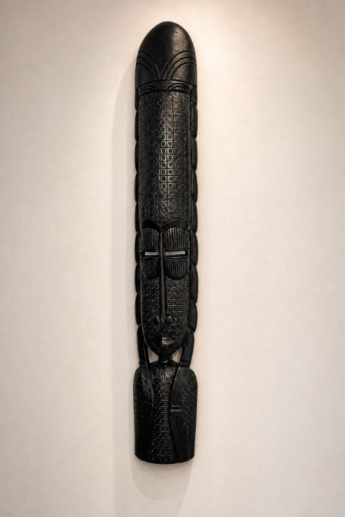 African wall sculpture by Tekura, Obaa Ebony Totem, featuring intricate carved details and a traditional African design.