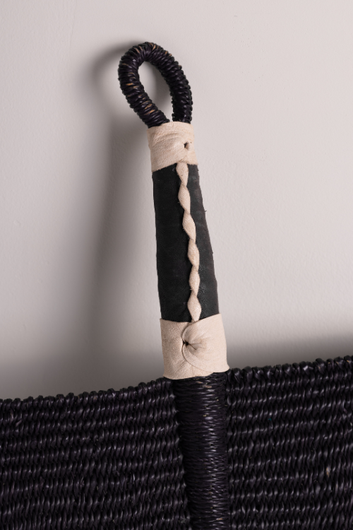 Baba Tree Bolga Decorative Fan noire. Close up of leather handle. Handwoven Elegance from Ghana - September Collective