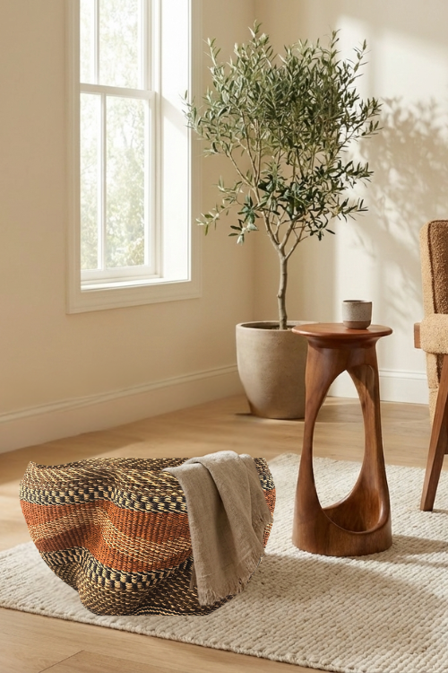 Room interior with a wooden side table, baba-tree-Pakurigo-Wave-Basket-Gurunsi, and potted plant.