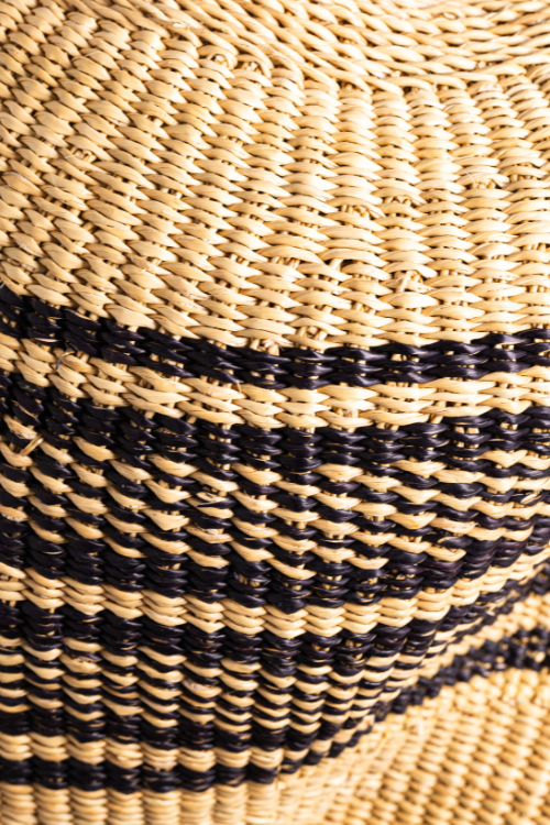 Close-up of Baba Tree Pebble Art Basket in ebony and natural tones, showcasing intricate pebble design and woven craftsmanship.