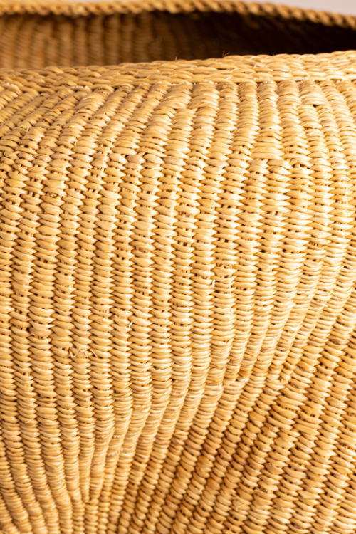 Close-up of Baba Tree Pebble Art Basket in Natural Dune, showing intricate pebble patterns and woven texture.