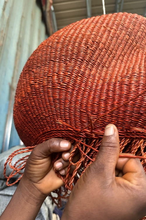 Baba Tree Basket - Sienna - Showing Artisan handcrafting basket