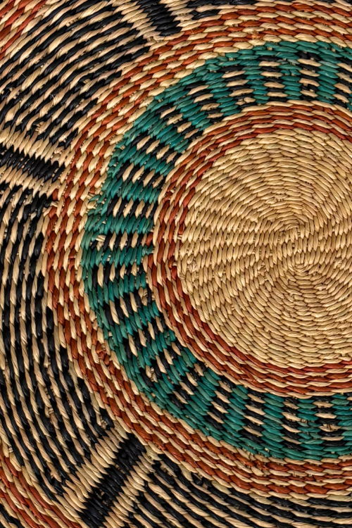Close-up of Baba Tree Golden Coast placemats featuring intricate patterns and a warm, natural color scheme.