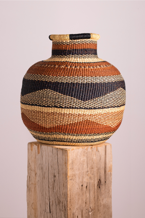 Baba Tree Jemima 10 Cows Basket art storage basket in brown, natural, and black woven from Gurunsi craft materials.