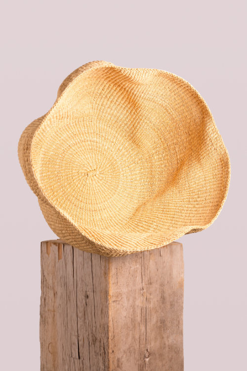 Baba Tree Pakurigo Wave Basket in Natural Dune, a stylish woven storage basket with a curved design and natural finish.