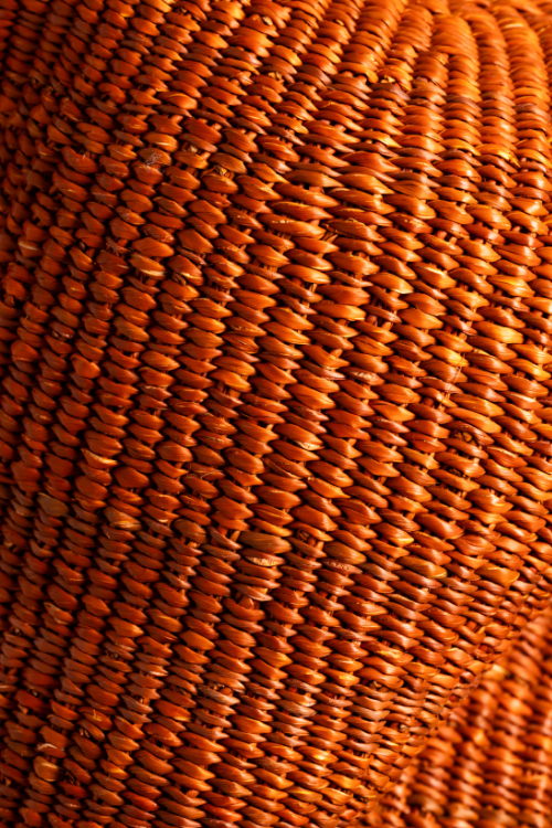 Close-up of Baba Tree Pebble Art Basket in Sienna, showcasing woven art basket with pebble design and natural texture.