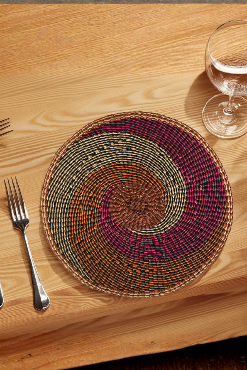 Baba Tree African Tide placemats featuring vibrant swirl patterns, made from woven material, ideal for table settings.