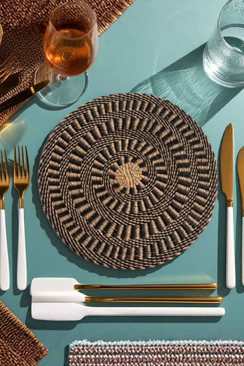 Woven Baba Tree placemats in ebony and natural tones, featuring a textured, handcrafted design for dining table decor.