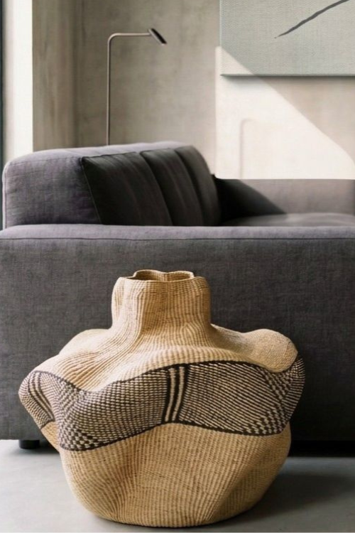 Close-up of Baba Tree Yoomelingah Yure artisan art basket in ebony and natural fibers showing intricate weaving details.