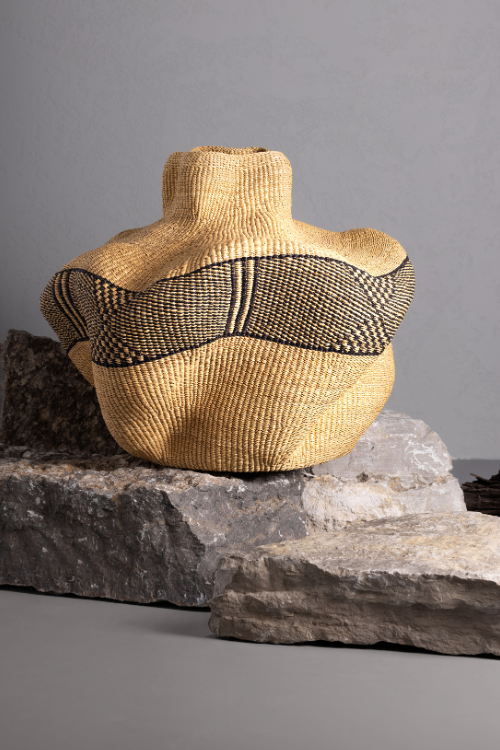 Natural and ebony Baba Tree Yoomelingah Yure artisan art basket with woven design, showcasing craftsmanship and textured materials.