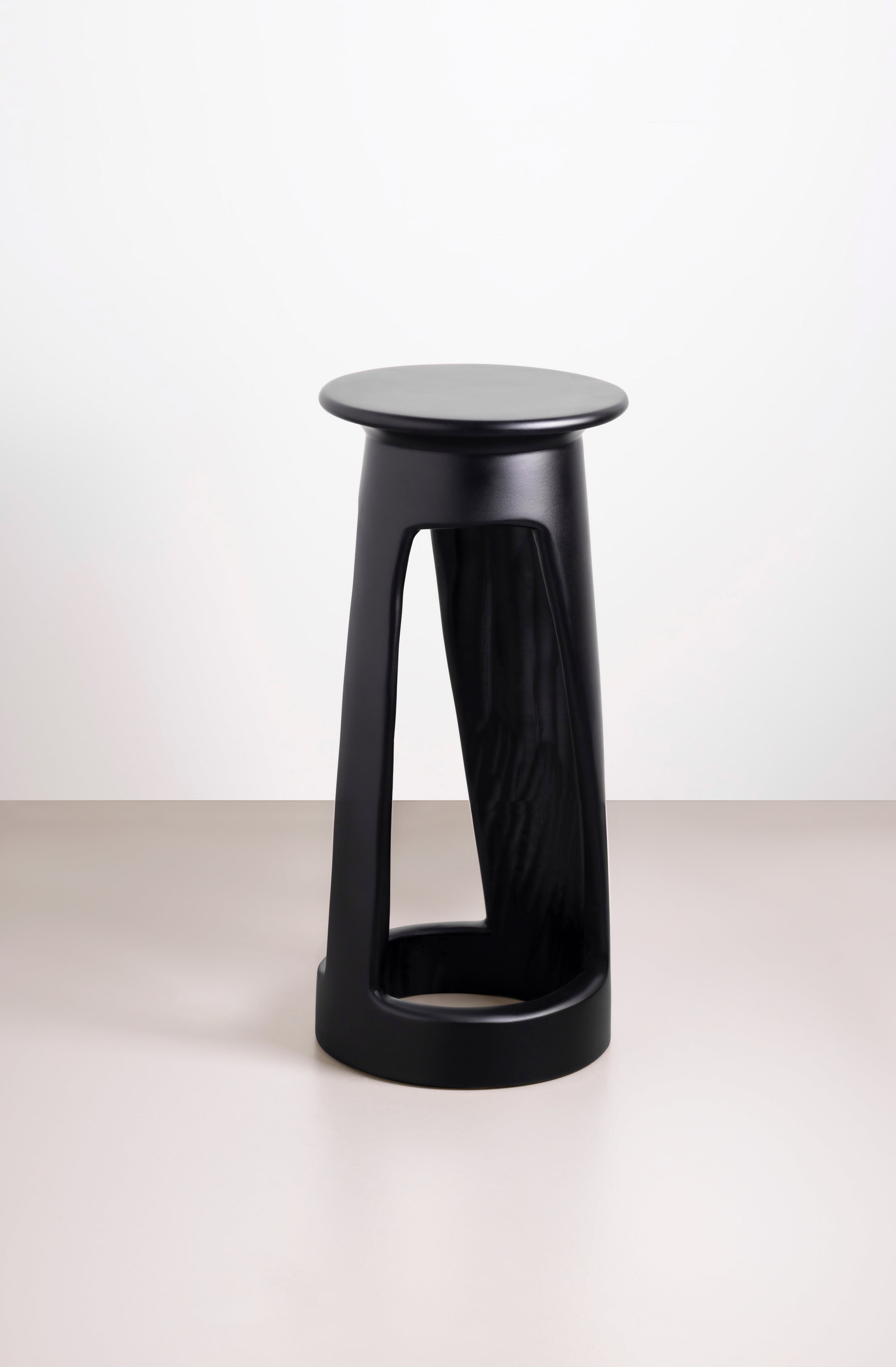 Black Djembe Round Accent Side Table by Tekura, featuring a drum-inspired design with a smooth finish.