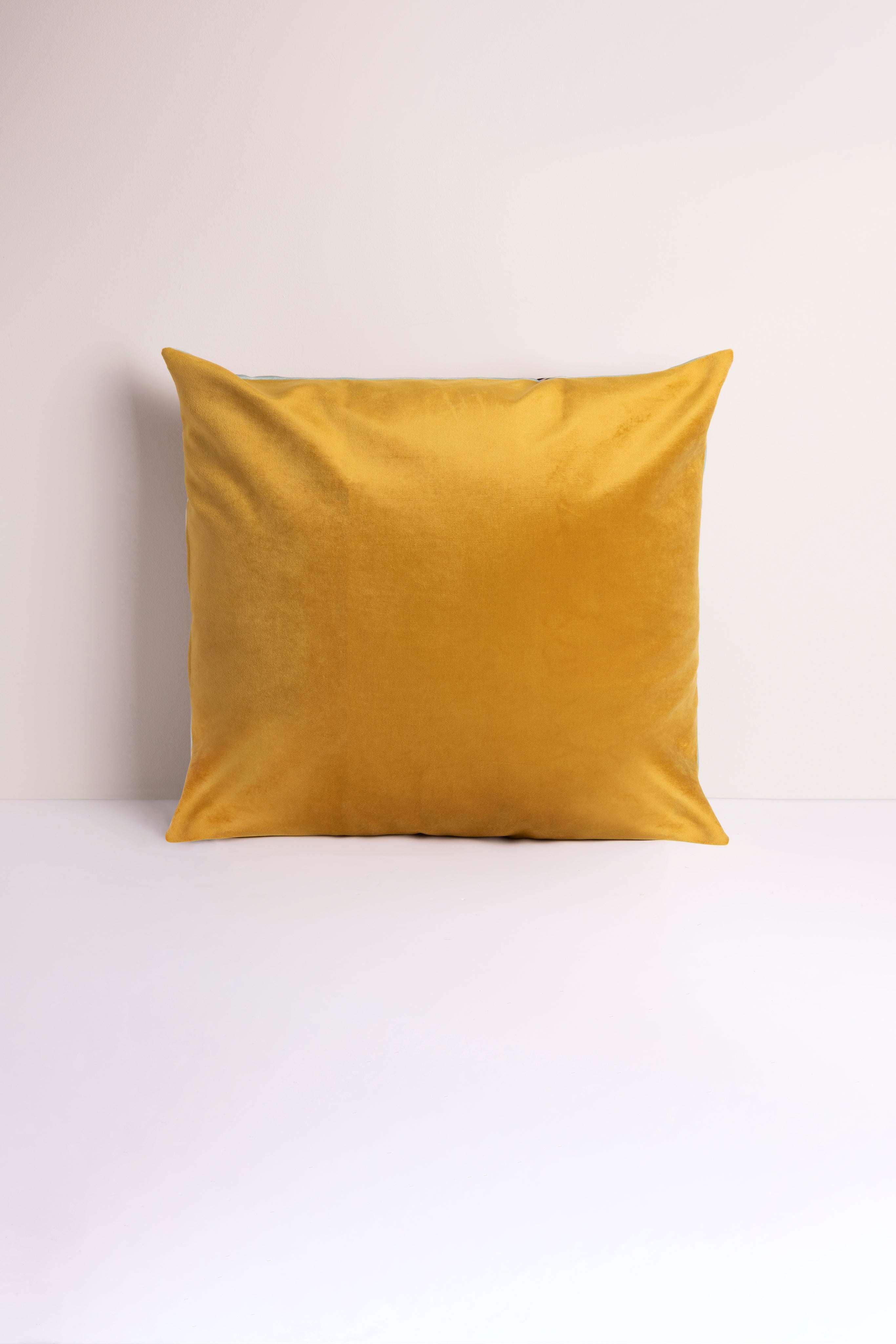 Mustard gold velvet pillow by Lulasclan with plush texture, measuring 22x22 inches, perfect for stylish home decor.