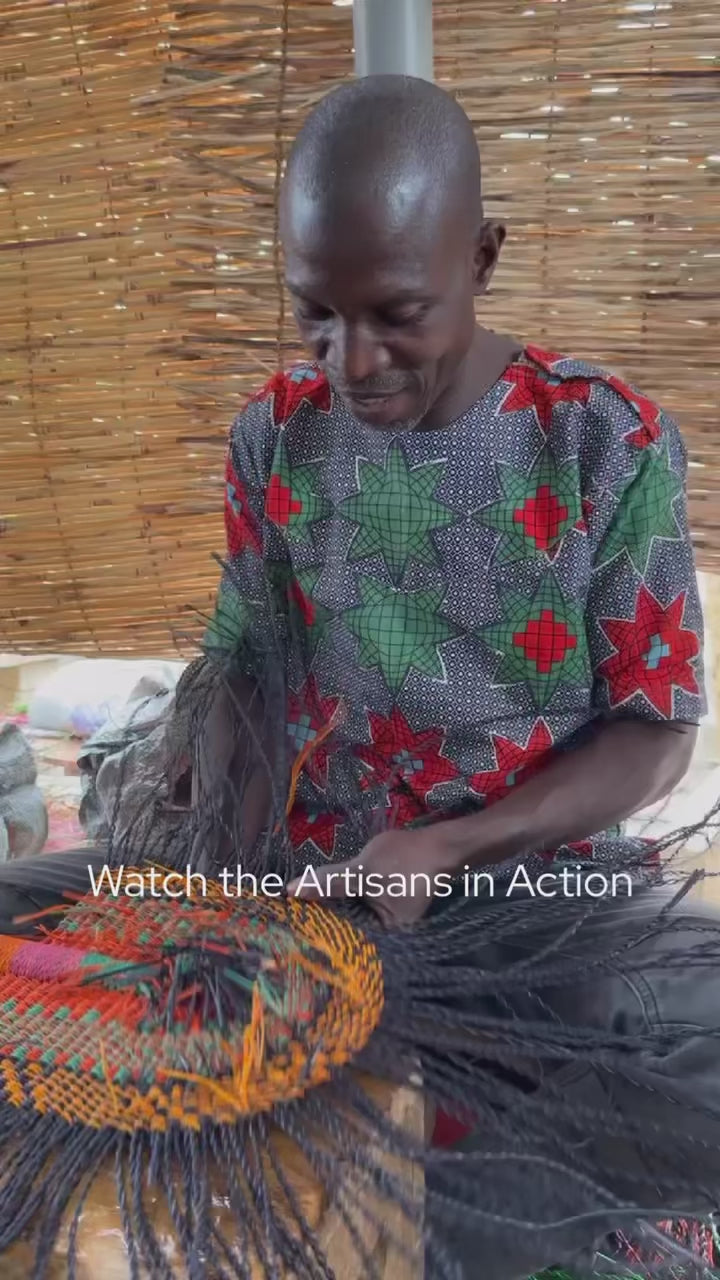 Baba Tree artisans weaving a bolga fan.