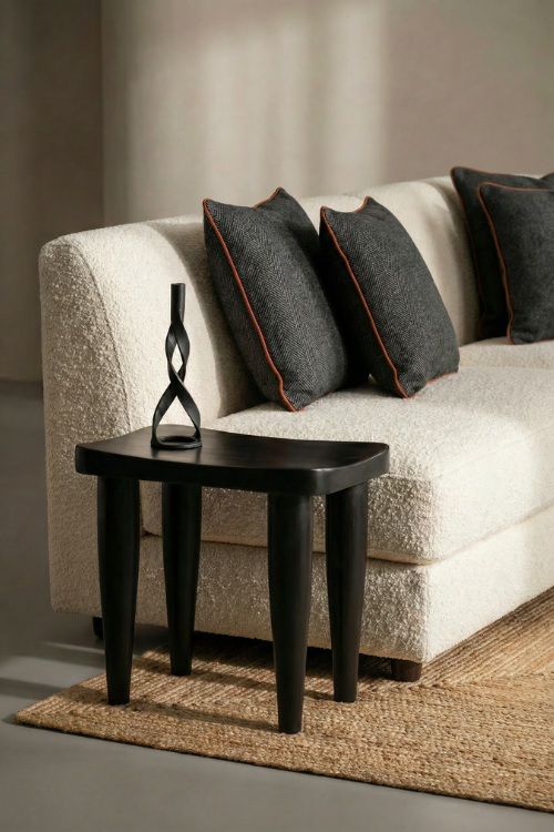 Black Tekura Anantu Stool featuring a sleek, modern design with a sturdy wooden frame and cushioned seat.