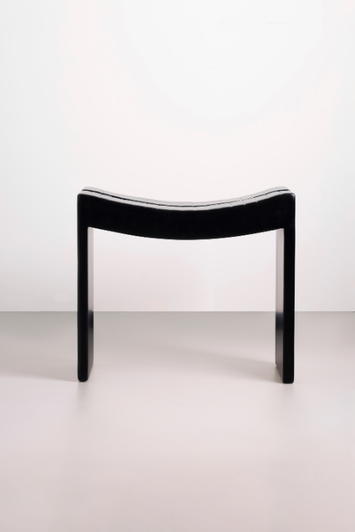 Front-facing view of Tekura Fante black stool, showcasing its modern design and sturdy construction for versatile seating.