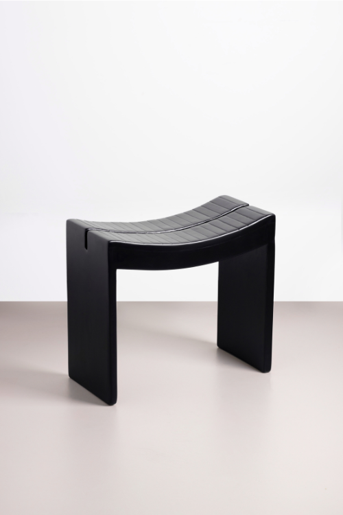 Black Tekura Fante Stool with wooden legs, traditional Ghanaian design, sturdy kitchen or casual seating option.