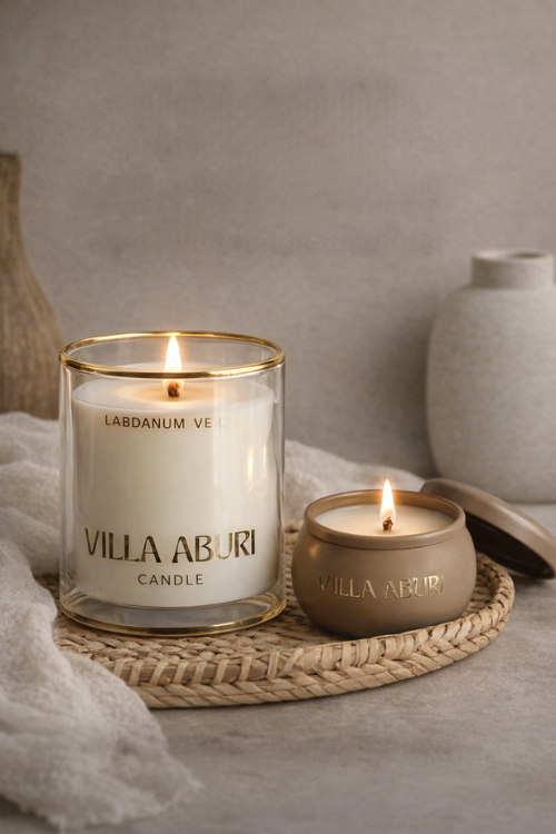 Villa Aburi Labdanum Veil scented candle in 11 oz glass jar, with a soft, elegant design and warm candle flame.