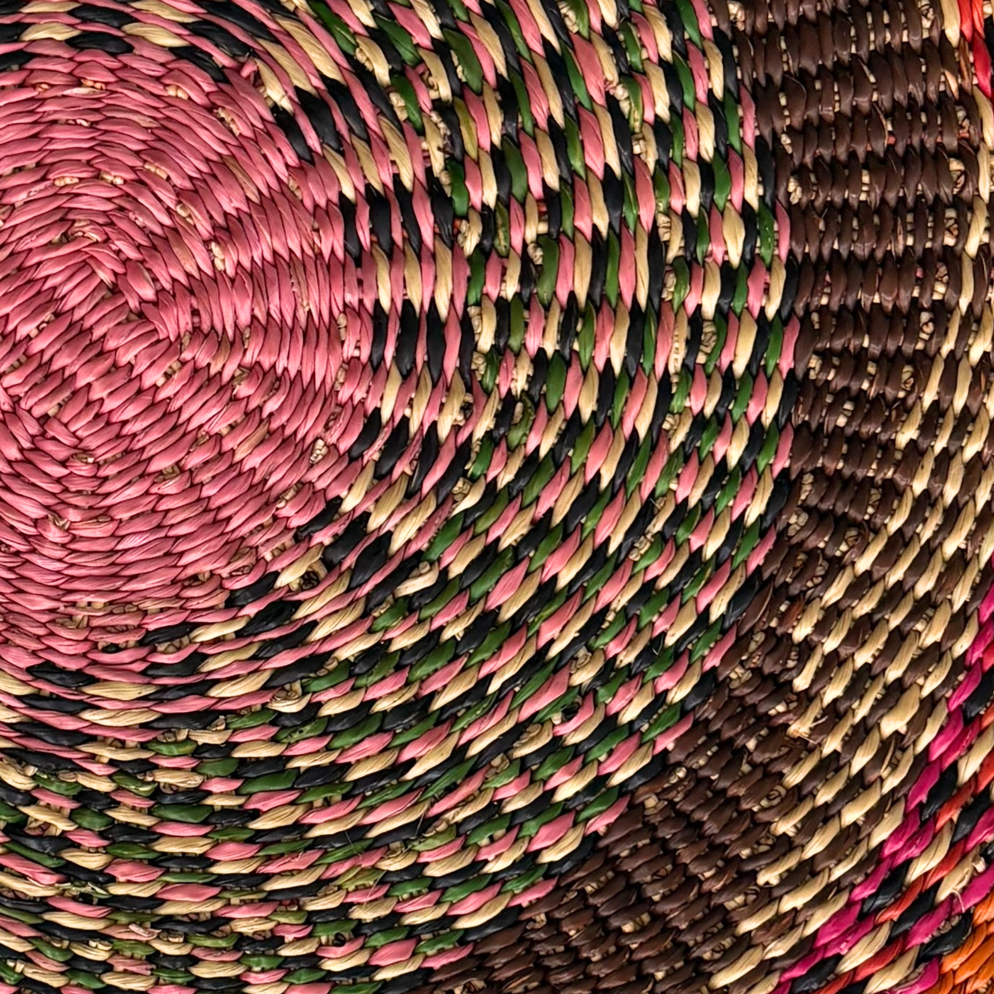 Baba Tree Placemats - Earthy Blossom. Close-up of woven placemats with pink, green, and brown colors.