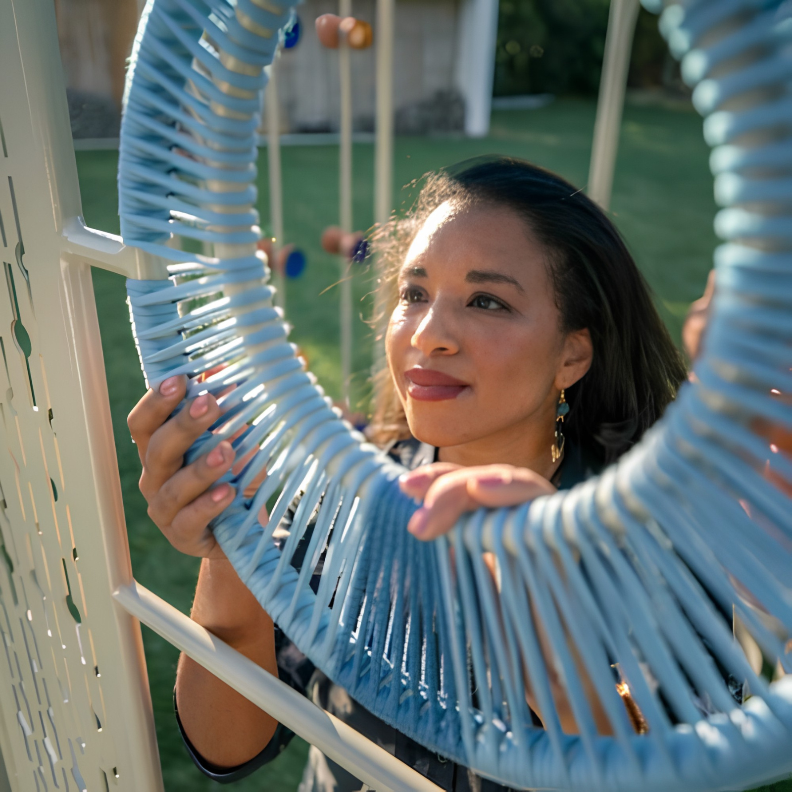 Candice Lawrence with the woven pendant light.
