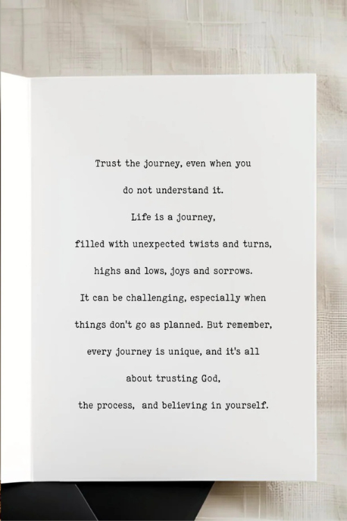 White card with black text on a wooden surface