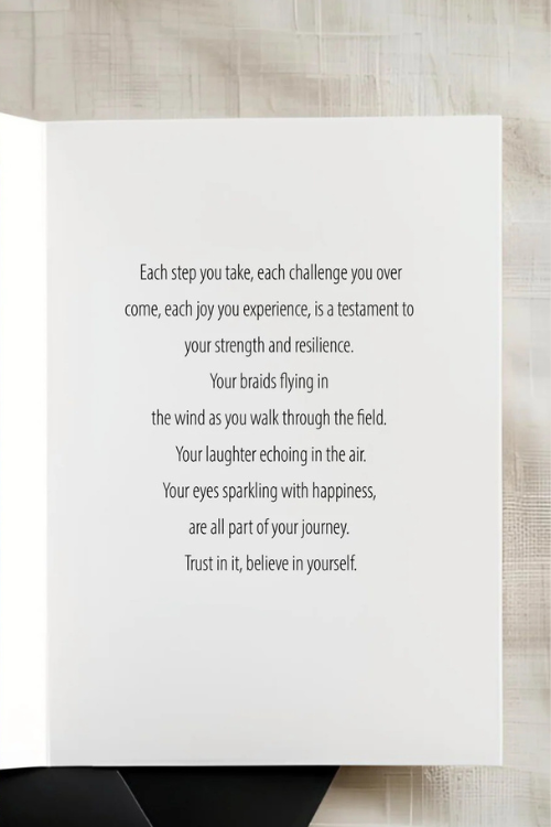 Text on a Rhen Art white card with a wooden background