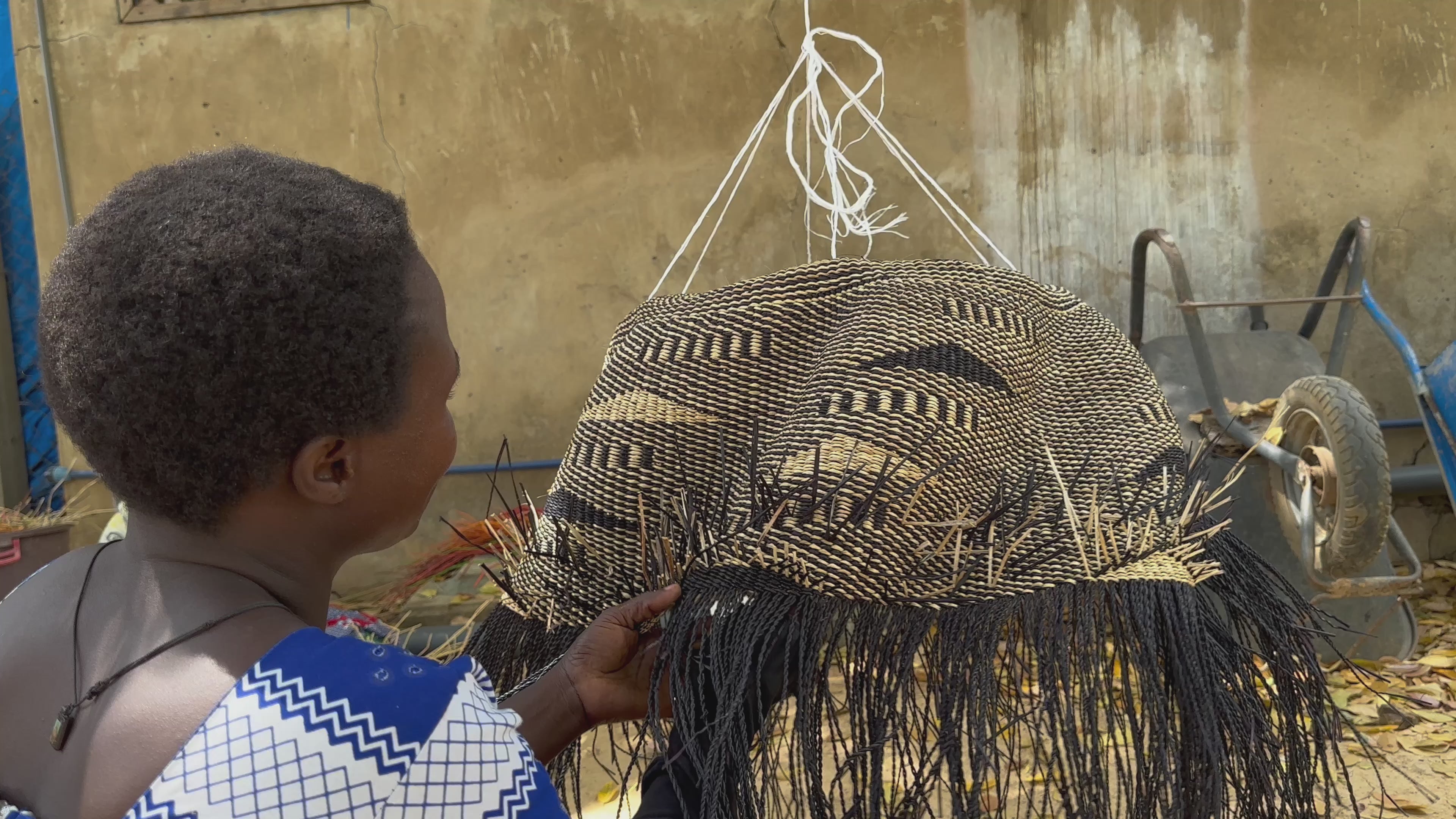 Video of Baba Tree Artist weaving basket