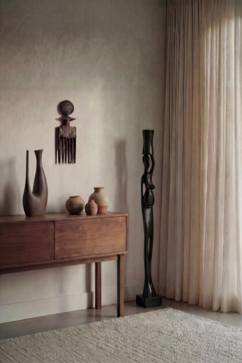 Tekura Akuaba Comb wall sculpture featuring a woman carrying a pot, showcasing traditional Ghanaian craftsmanship and cultural design.